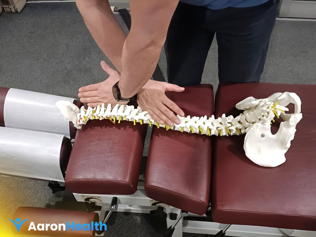 Dr. Nathan Cogoi performing Chiropractic Care