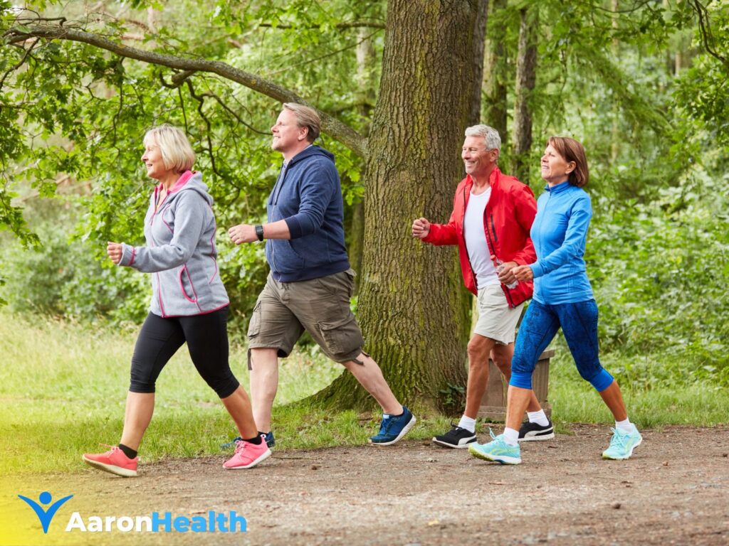 Group of older adults enjoying a low-impact walk in the park