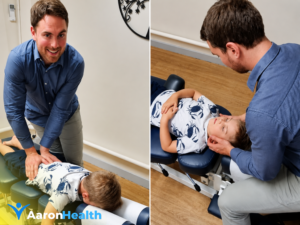Chiropractor providing gentle care to a child during a chiropractic appointment